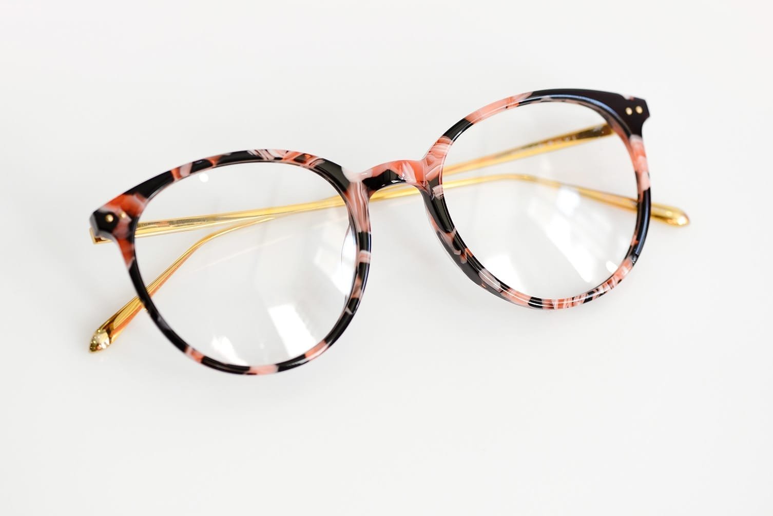 Female fashion glasses on white background